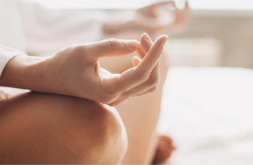 Close up of a woman in a meditation position