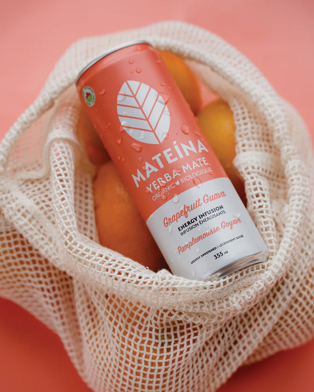 Mateina can in a mesh bag with oranges